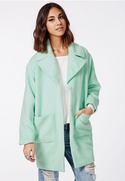 Model wearing the mint Lena cocoon coat from Missguided.