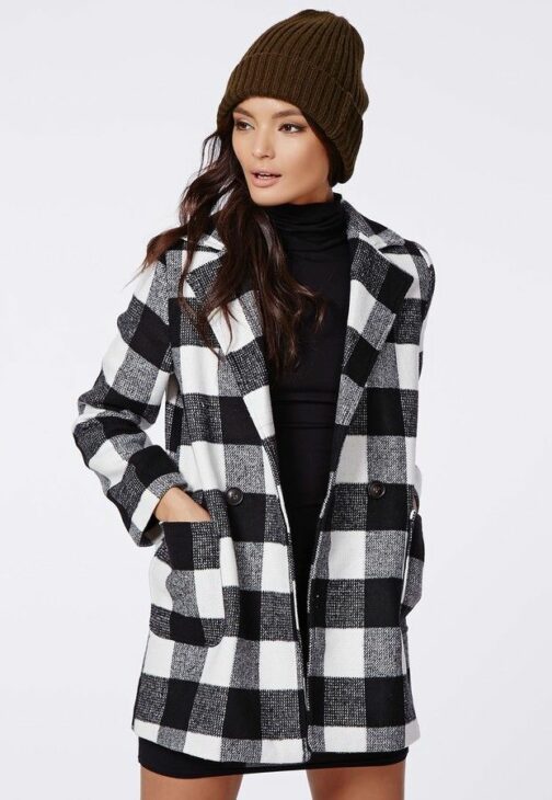 Model wearing the black check Lily lumberjack coat from Missguided.