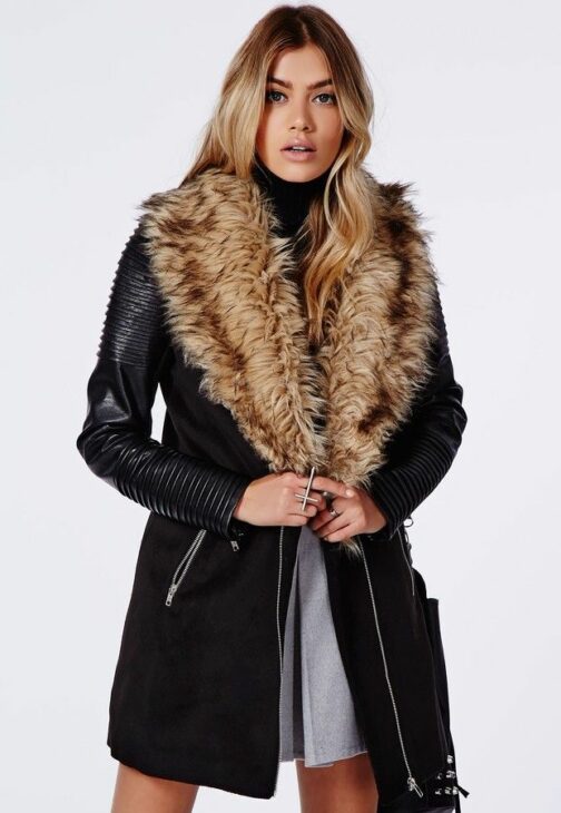 Model wearing the Orla black faux fur and leather biker sleeve coat from Missguided.