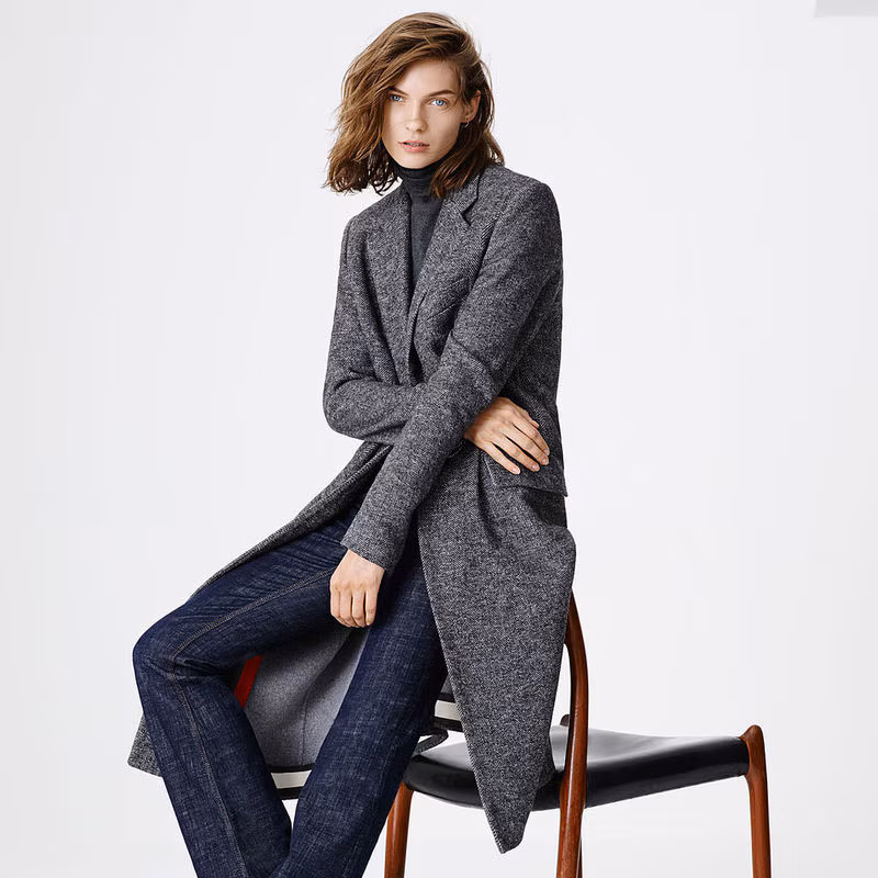 Model wearing a grey tailored coat and turtleneck from the Zara winter collection.