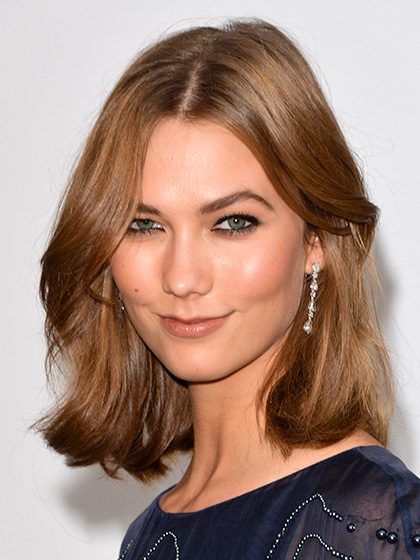 Karlie Kloss medium length hair with rumpled texture.