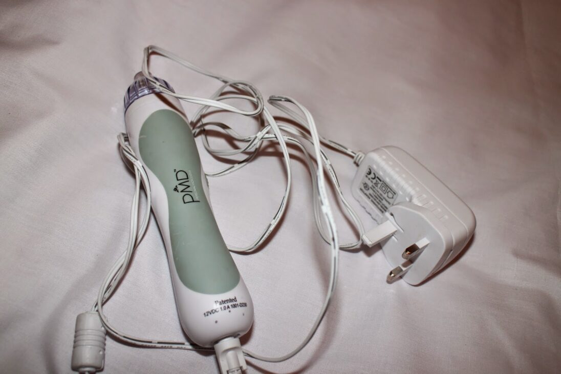 The PMD Personal Microderm device with its power cable.