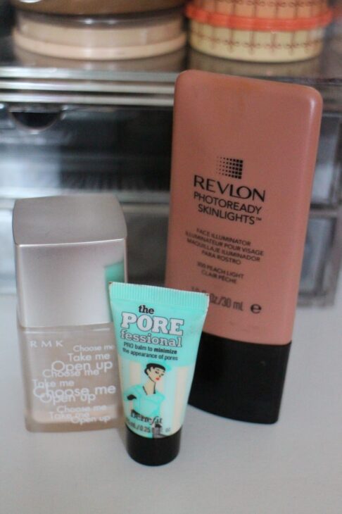Group arrangement of favourite makeup base products including RMK Make-Up Base, Benefit The POREfessional, and Revlon Photoready SkinLights.