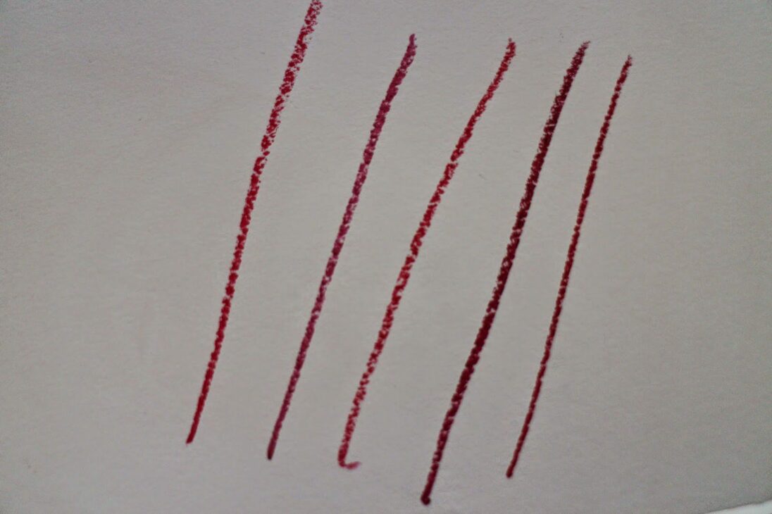 Five best red lipsticks arm swatches side by side comparing red undertones
