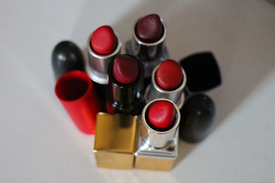 Cluster of lipsticks grouped closely together upright