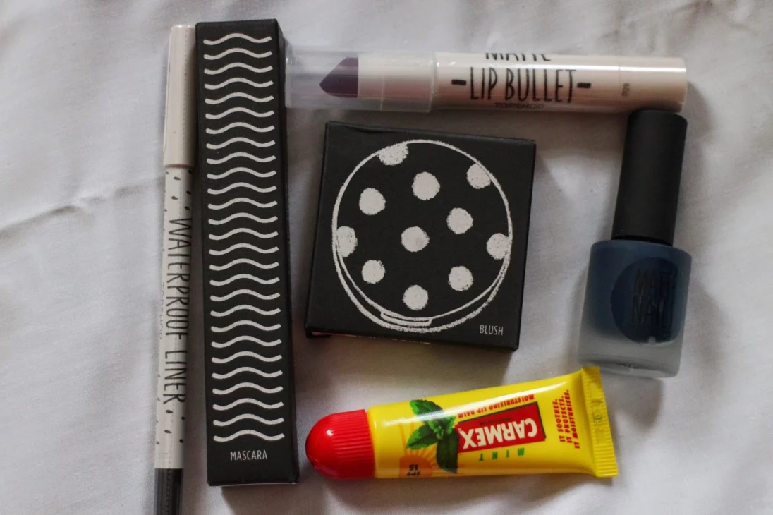 Topshop Beauty budget buy makeup haul flatlay featuring lipstick and blush