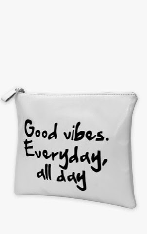 PrettyLittleThing Cheryl white envelope clutch with bold Good Vibes typography