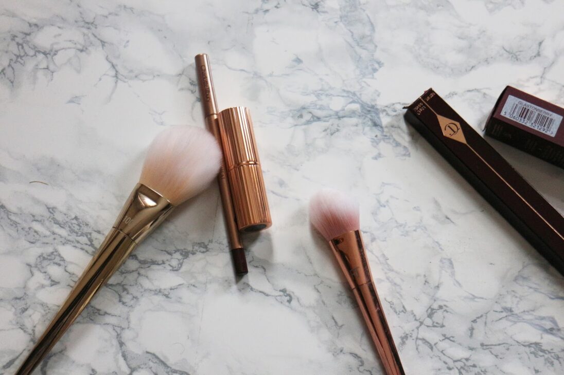 Charlotte Tilbury Matte Revolution lipstick tube open showing berry shade.
