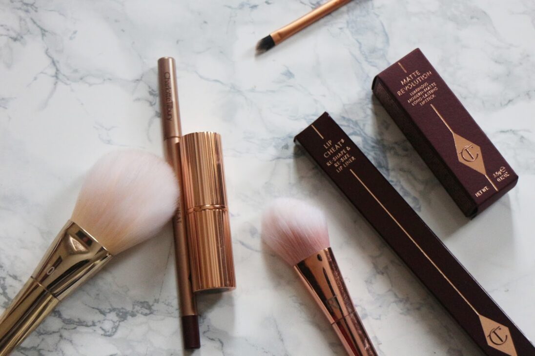 Charlotte Tilbury Lip Cheat in Berry Naughty beside Glastonberry lipstick